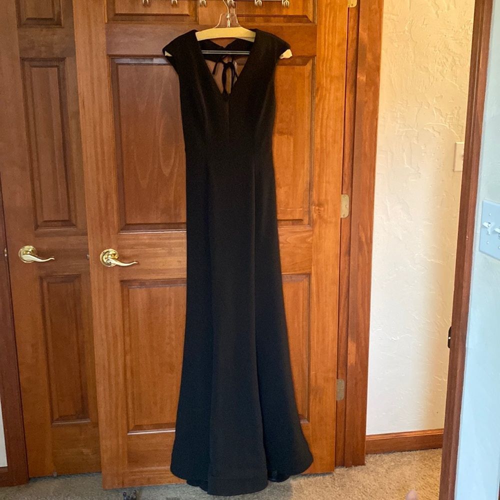 Black floor length evening gown with train.  Worn once.